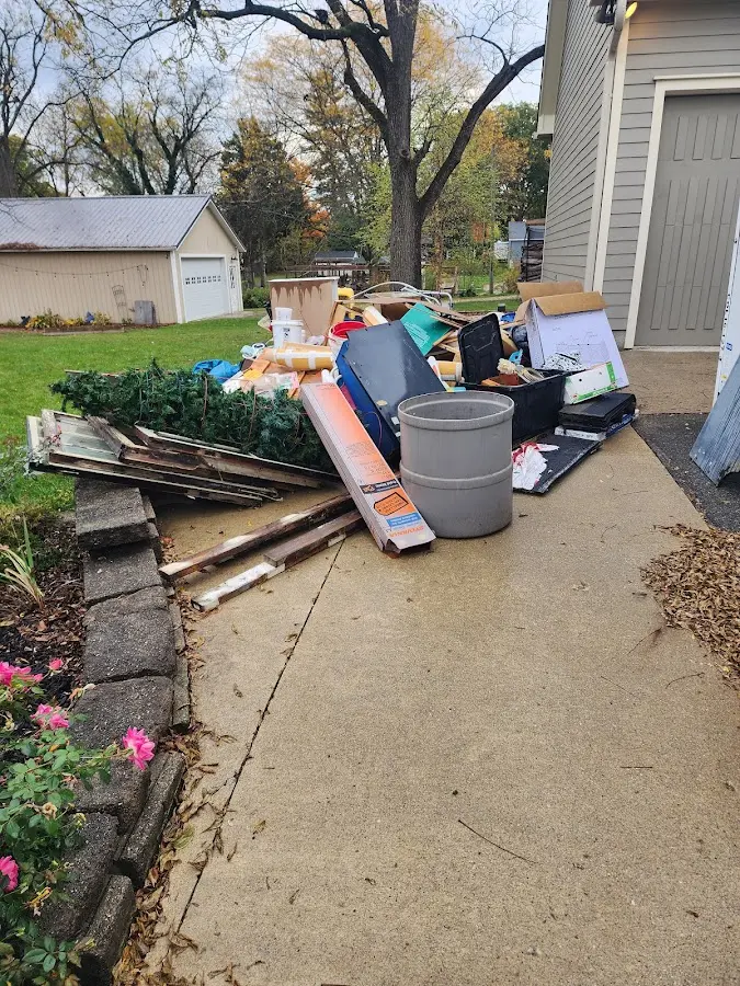 Dumpster being loaded with debris for 30 Yard Dumpster Rental in Wellston